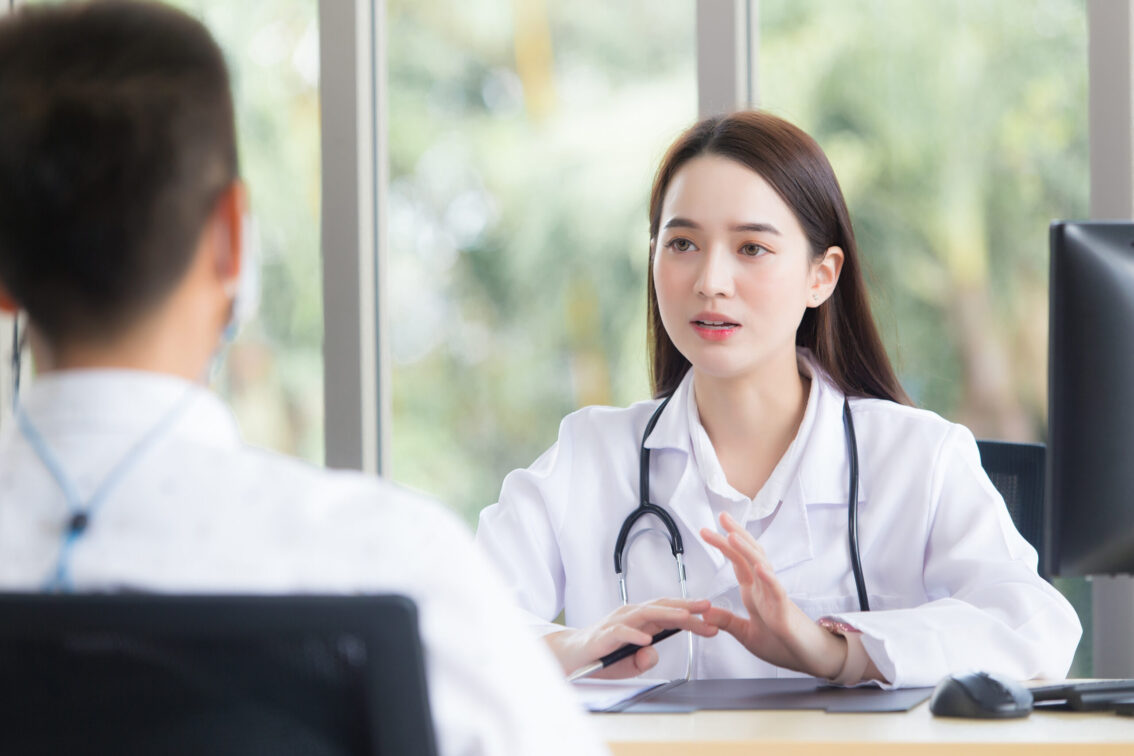 Asian,Elderly,Man,Patient,Consults,With,Professional,Woman,Doctor,About